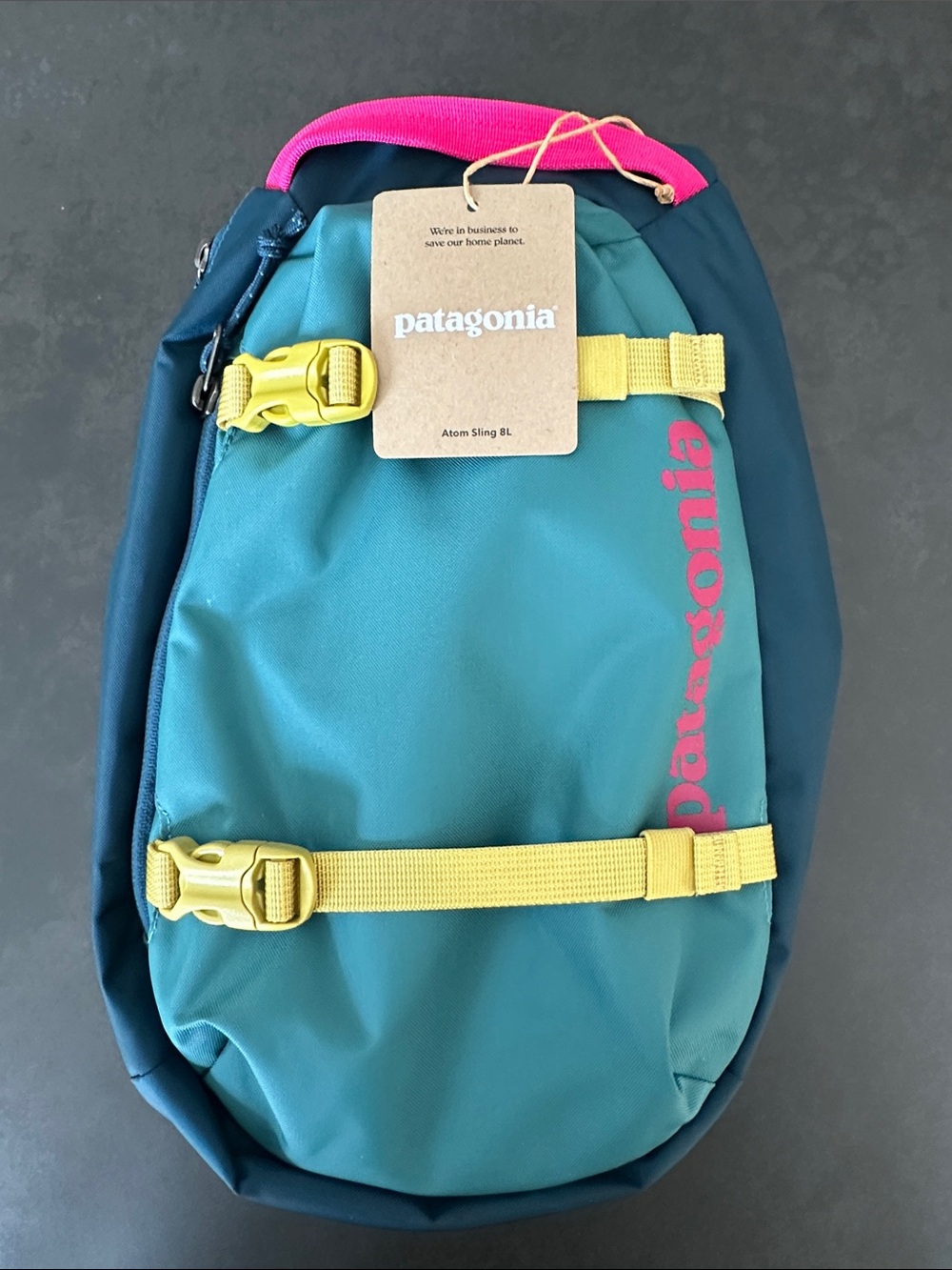 Patagonia Wetland Blue Atom Sling Pack with Yellow Straps and Pink Accents